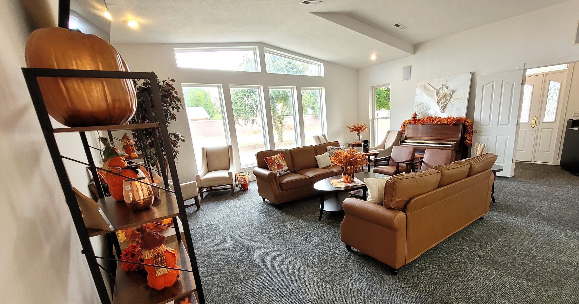 Resident lounge with large windows and comfortable sofas