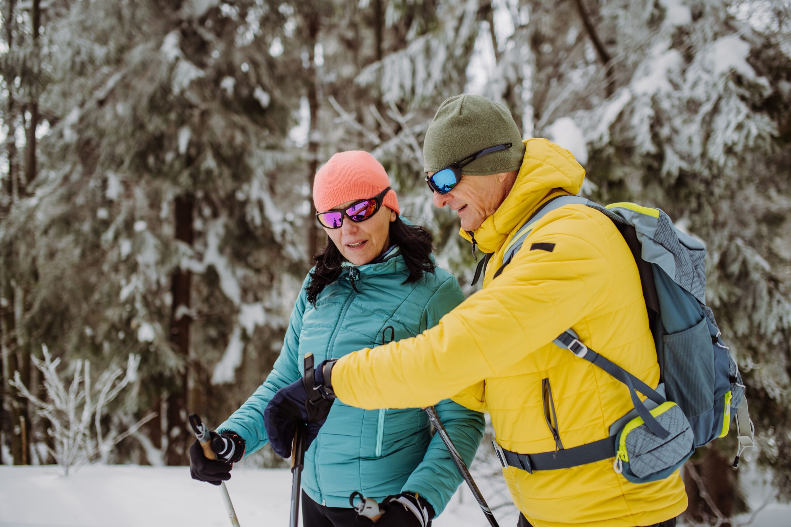 active seniors hiking winter forest scaled