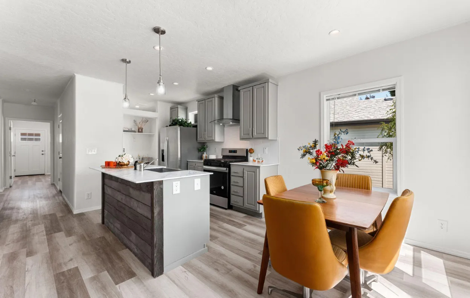 contemporary kitchen and dining area with oversized island at brooke view in boise id