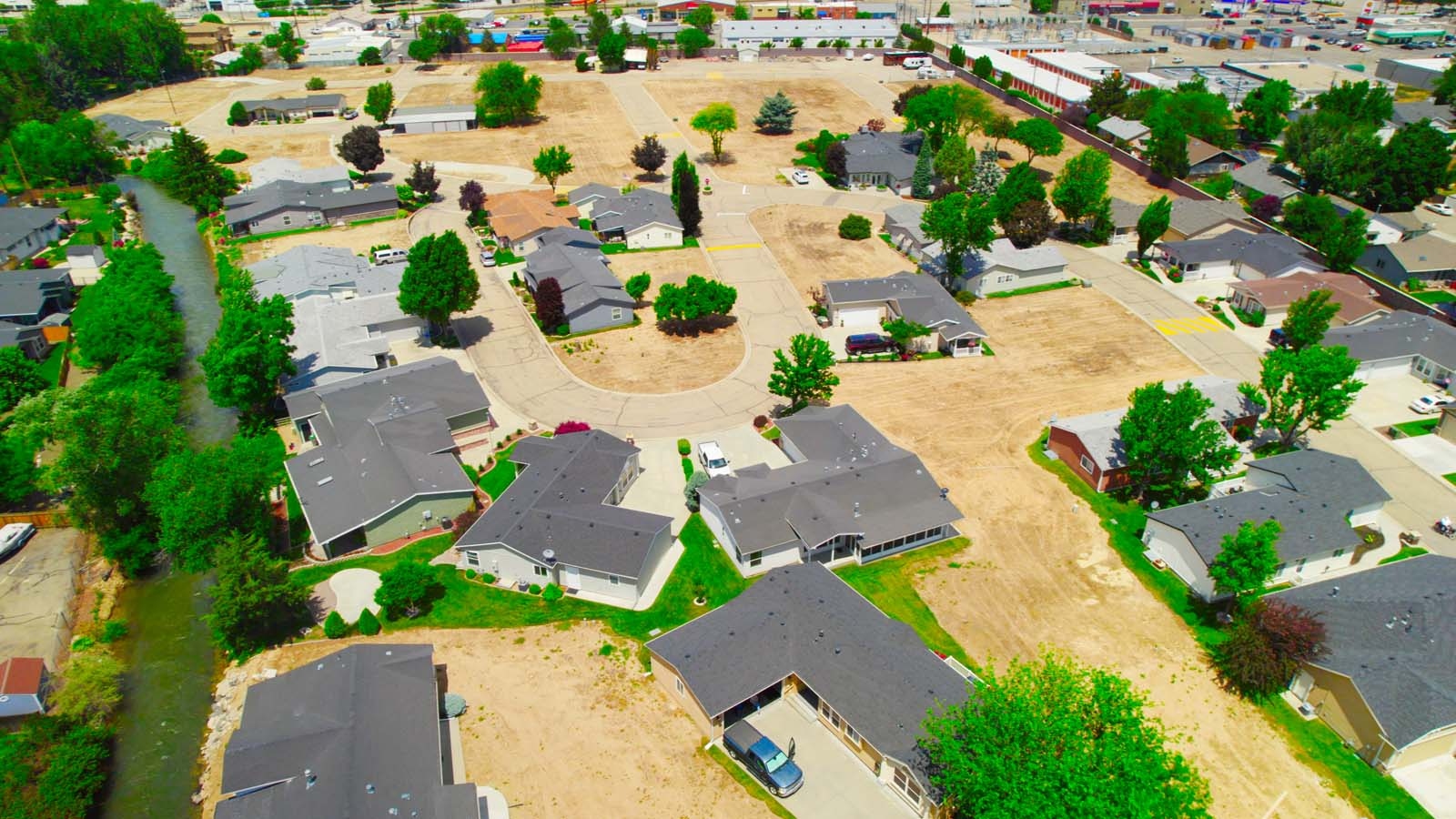 expansive aerial view of single story homes and canal at brooke view in boise id