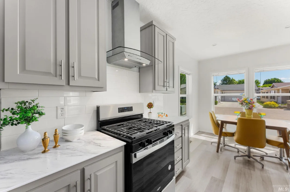 modern kitchen with grey cabinetry and gas range at brooke view in boise id