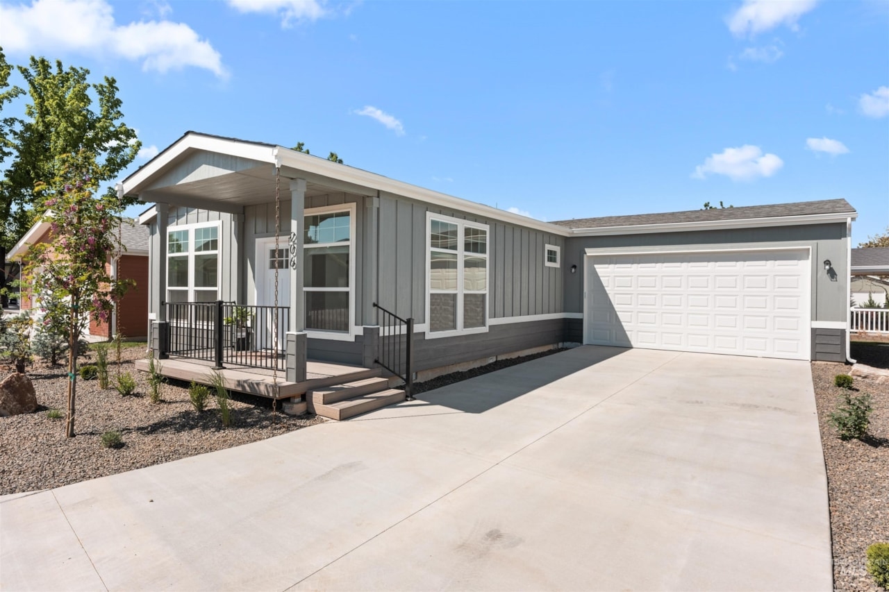 pristine manufactured home exterior with two car garage at brooke view in boise id