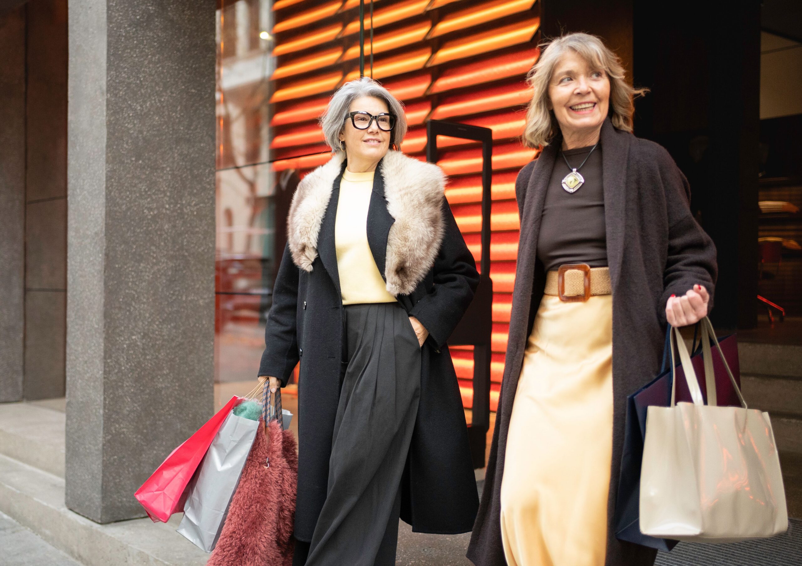 senior women carrying shopping bags scaled