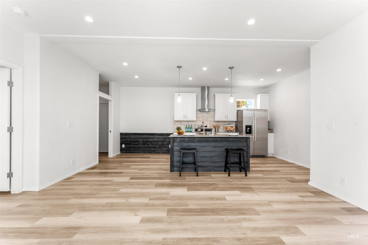 spacious open concept living and kitchen area at brooke view in boise id