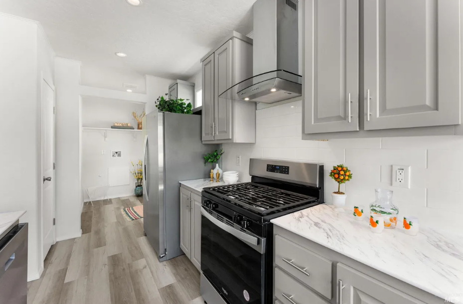 updated kitchen with stainless steel gas range at brooke view in boise id