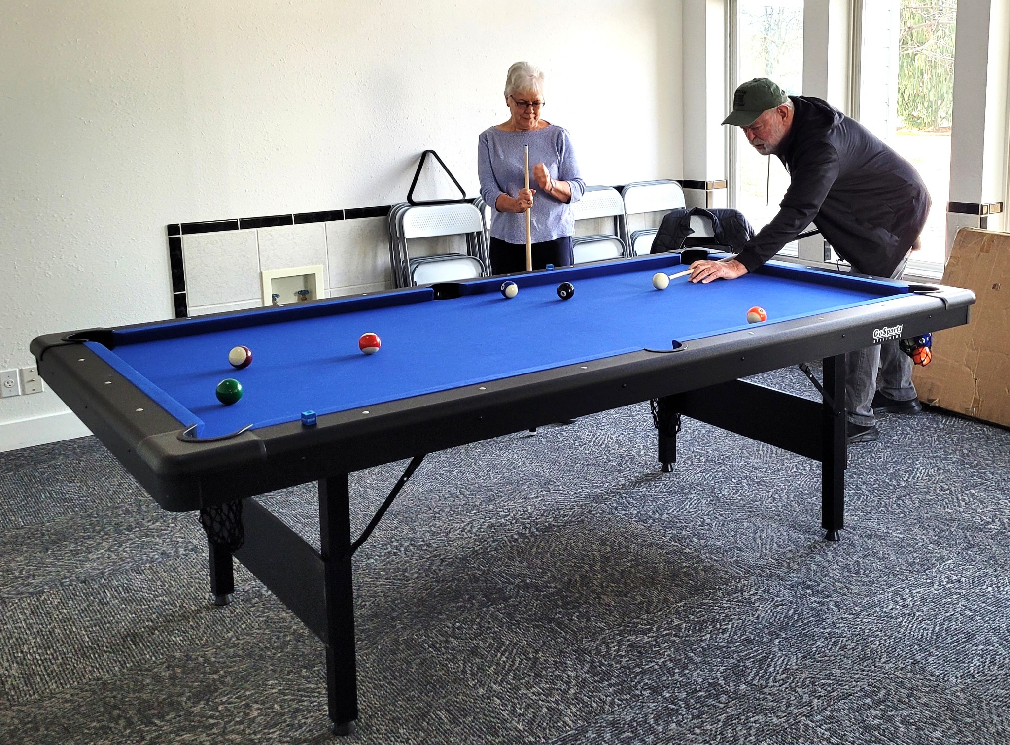 Residents enjoying the pool table at Brooke View MHC